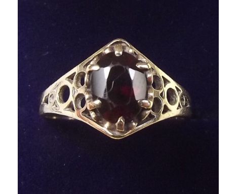 A 9 carat gold garnet set ring, size P