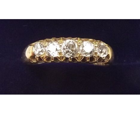 An 18 carat gold five stone diamond ring, size R