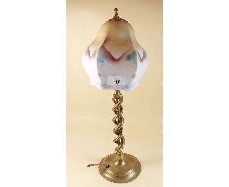 A brass wrythen twist table lamp and shade