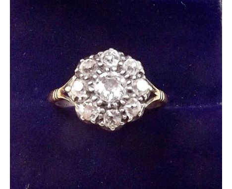 An 18 carat gold diamond cluster ring