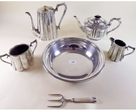 A silver plated coffee pot, milk and sugar and a silver plated floral decorated teapot plus a silver plated serving dish and 