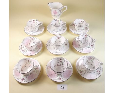 A Victorian part pink lustre tea service comprising eight small cups and saucers and a milk jug