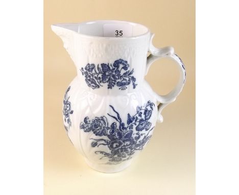 An 18th century Caughley blue and white 'mask' jug circa 1780 a/f