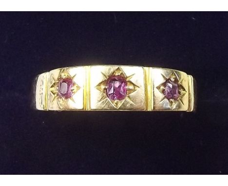 A Victorian 15 carat gold ring set three rubies - size O