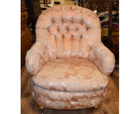 An upholstered button back nursing chair, with gilt legs