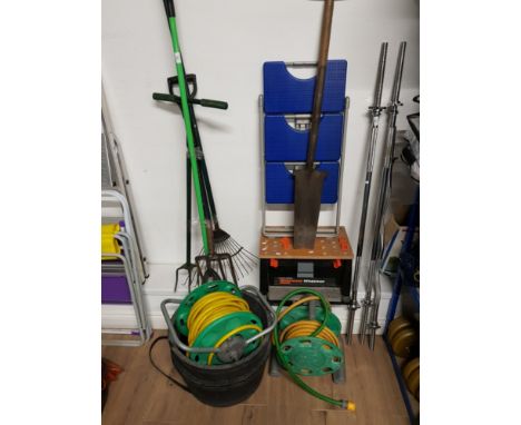 TWO HOSE ON REELS WITH A BUNDLE OF GARDEN TOOLS AND WORKMATES WORKBOX ETC