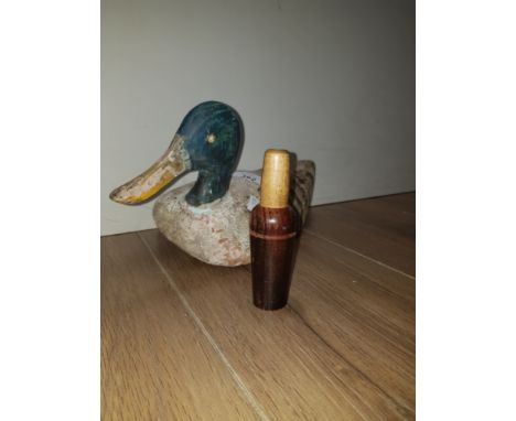 A MALLARD DECOY DUCK AND HUNTING CALL