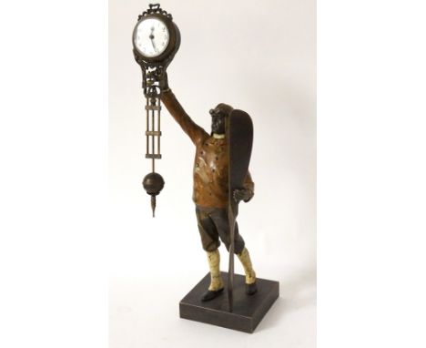 VINTAGE NOVELTY AVIATOR TIMEPIECE
the handpainted spelter pilot figure standing holding a propeller, the swinging timepiece w