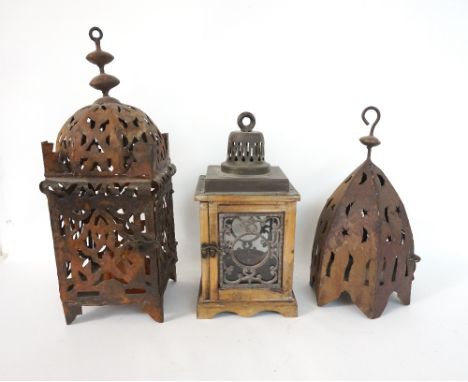 TWO EASTERN STYLE PIERCED METAL LANTERNS
the tallest 46cm high, and a glazed wooden lantern (3)