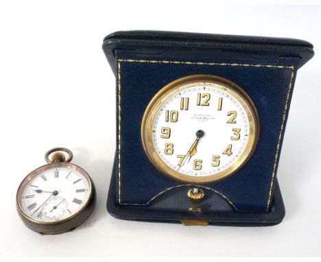 GUN METAL POCKET WATCH
with top winder, black Roman numerals and subsidiary dial on white enamel, and a vintage travel clock,