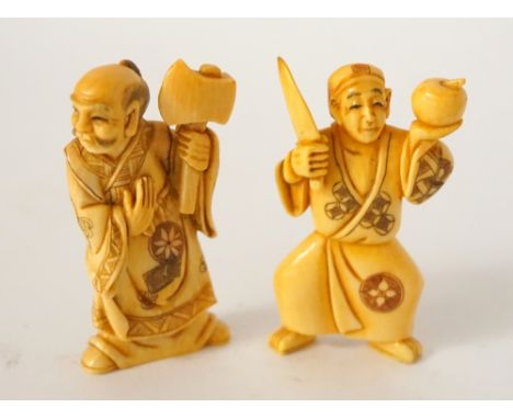 CARVED IVORY NETSUKE
of a man holding a knife and apple, 5cm high; and an ivory netsuke of a man holding an axe 5cm high 