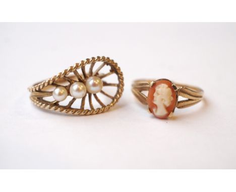 TWO NINE CARAT GOLD RINGS
one with three pearls in unusual pierced setting and the other with a cameo, ring sizes J and K-L