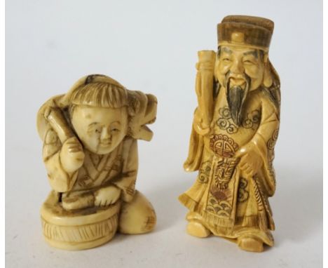 JAPANESE CARVED IVORY NETSUKE
of a boy drumming with a dog, 4.4cm high; and a Japanese ivory netsuke of Shoki the demon quell