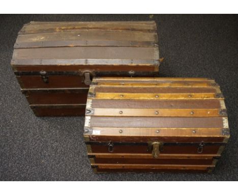 TWO VINTAGE WOODEN BOUND DOMED TOP TRAVEL TRUNKS
both with metal edging and detail, 59cm high x 93cm wide x 52cm deep and 50.