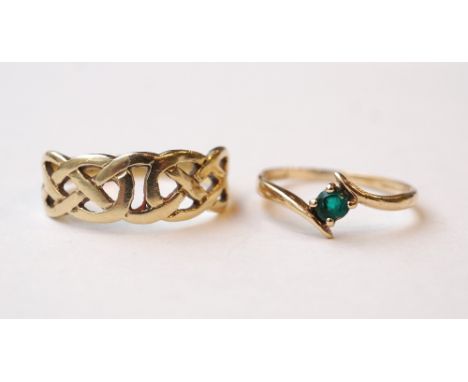 TWO NINE CARAT GOLD RINGS
one with pierced Celtic motif decoration and the other with green stone, ring sizes O and K-L respe