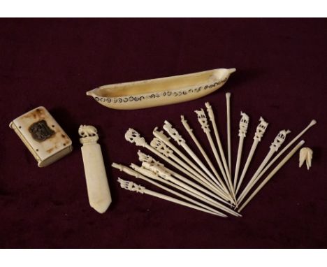 MIXED LOT OF CARVED IVORY
comprising a double ended vesta case in the form of a book, with striker to spine and applied white