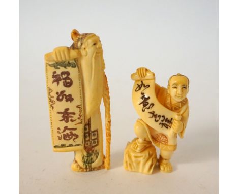 CARVED IVORY NETSUKE
of an old man with a staff, holding a scroll, 6.1cm high; and an ivory netsuke of a man holding a scroll
