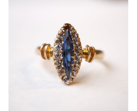 MARQUISE SHAPED BLUE AND CLEAR GEM SET CLUSTER RING
on nine carat gold shank, ring size R