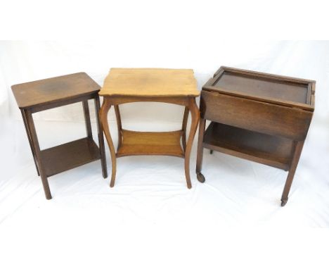 TWO VINTAGE OAK PLANT TABLES
one with shaped top, both with undertiers, and a period oak tea trolley with undertier and raise