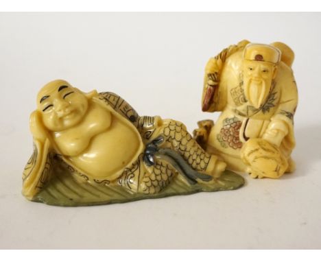 CARVED BONE NETSUKE
of a reclining Buddha on a leaf, 7.8cm long; and a bone netsuke of an old man standing by rats 5cm high 
