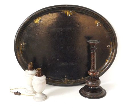 EBONISED OVAL TRAY
with a giltwood border and mother of pearl inlay, 75.5cm wide; a pair of wooden urn shaped table lamps, 22