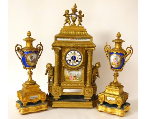 19th CENTURY FRENCH GILT CLOCK GARNITURE
the clock with cherub and handpainted urn finial, above a decorative corinthian colu