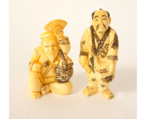 CARVED IVORY NETSUKE
of a man holding a fan and a bag over his shoulder, 6cm high; and a carved ivory netsuke of a man seated