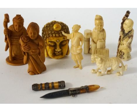 TWO CHINESE CARVED BOXWOOD FIGURES
of a mother holding her child, and an old lady holding a staff and a basket of flowers, 5.