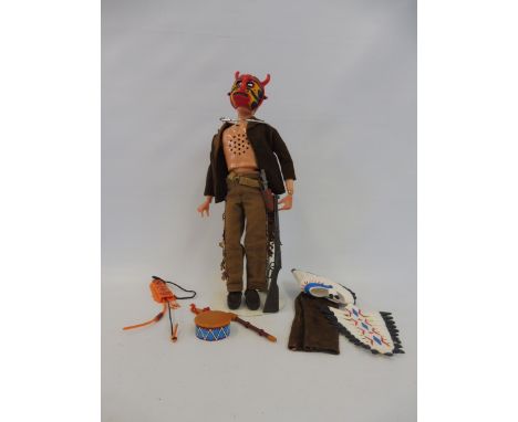 A 1970s Action Man figure with blond flock hair, Geyper Man, Native Indian oufit and accessories.