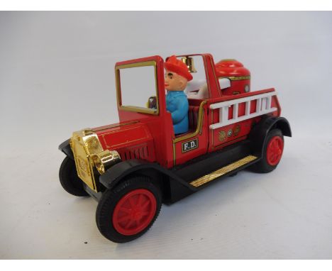 A boxed Bandai part tinplate fire engine.