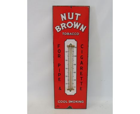 A Nut Brown Tobacco enamel thermometer in excellent condition, 7 1/2 x 22 1/2".