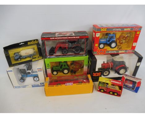 A quantity of farm vehicles to include tractors and trailers of different scales and makes.
