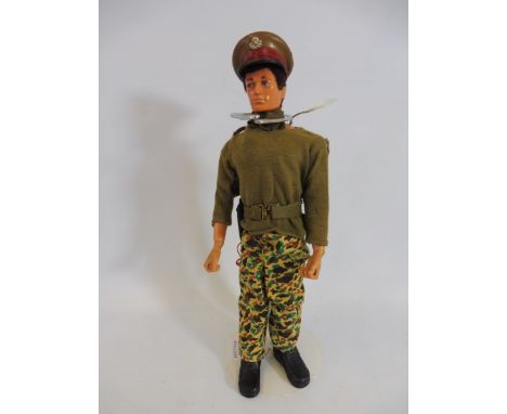 A circa 1970s Action Man figure, a talking commander, still working but plays slow.