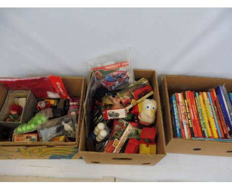 Three boxes of assorted toys to include Thomas the Tank Engine, puppets, games and a mixed quantity of annuals.