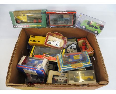 A quantity of mixed vehicles, mainly boxed, different scales and makers, including Ertl, Corgi etc.