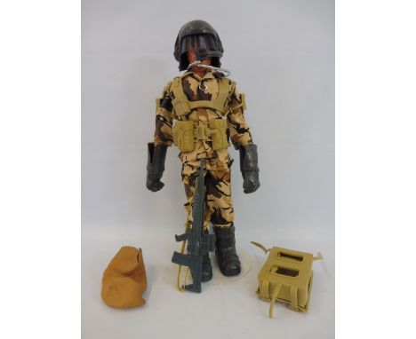 A circa late 1970s/early 1980s Action Man in excellent condition, wearing ground assault uniform with webbings and accessorie