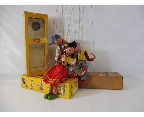A boxed Pelham puppet 'Gypsy', late 1960s in original box, all wooden construction and nicely costumed, felt flowers in hair 