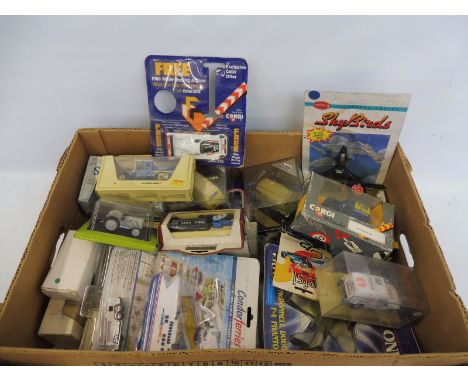 A quantity of die-cast vehicles, mainly boxed, various scales, commercial vans etc.