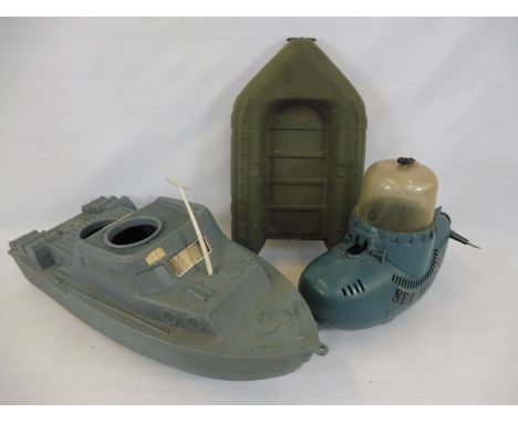 A 1970s Action Man motor patrol boat, assault craft and a Sea Wolf submarine.