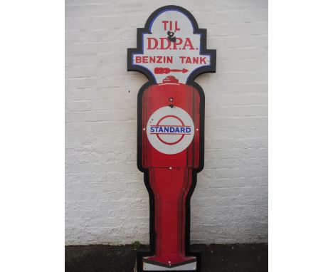 A rare die-cut enamel sign in the shape of a petrol pump, advertising 'Standard' oil, Benzin Tank, mounted on a board for dis