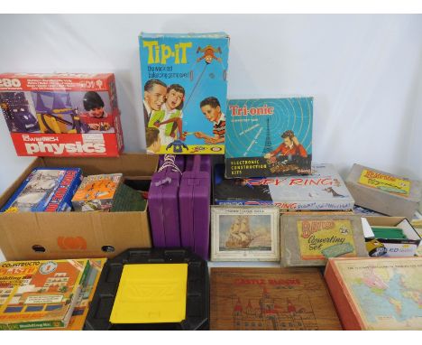 Three boxes full of mixed toys and games to include Victory puzzles and a quantity of Bayko, plastic construction etc.