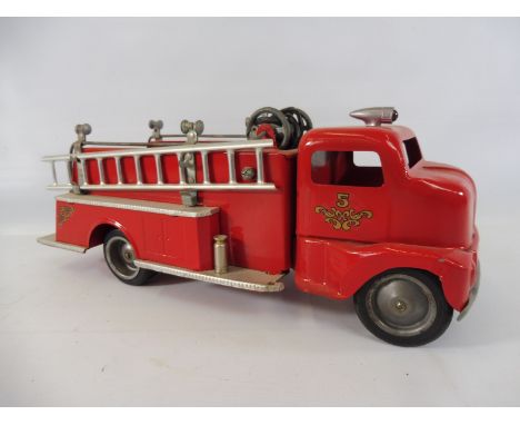 A first generation 'cab-over'- Tonka tinplate fire engine.