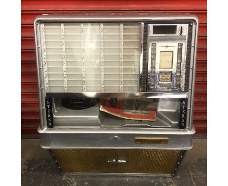 A late 1950s Rockola 100 wall mounted juke box, cabinet style, in full working condition, video of this machine playing curre