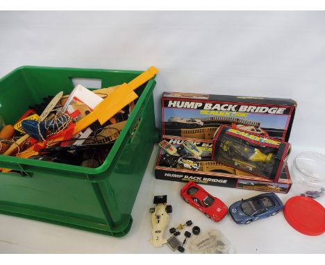 A large amount of Scalextric, including loose cars, hump back bridge, accessories etc.