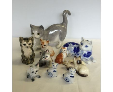 A quantity of ceramic cats to include Beswick and Tey Pottery.