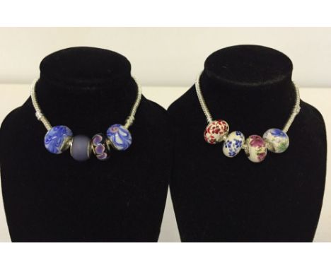 925 silver bracelet with blue tone Murano glass beads together with a 925 silver bracelet with floral ceramic beads.