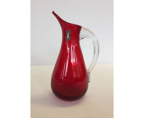 A Whitefriars ruby red glass jug. 18cm tall.