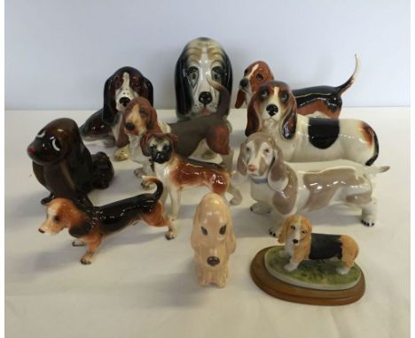 A quantity of ceramic dogs to include Beswick and Sylvac.