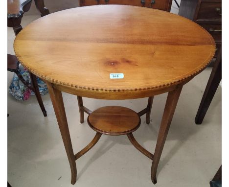 An Edwardian oval inlaid mahogany occasional table with under shelf 