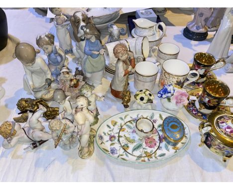 A Nao porcelain dog; a similar cat; 5 other pieces; 2 continental porcelain cherubs; a Wedgwood part coffee set; decorative c